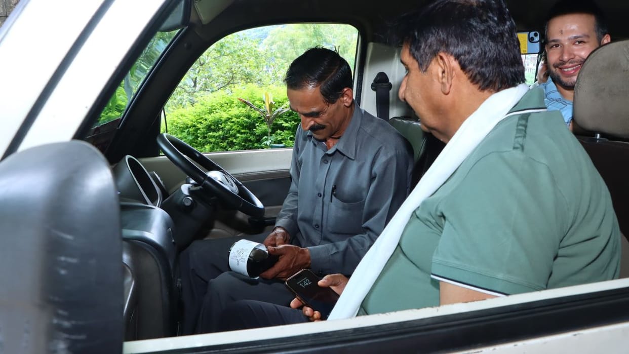 Deputy CM Mukesh Agnihotri travelling in Ride with Pride and also took feedback from the driver