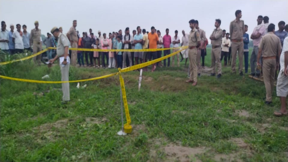 Bloody body of a young man found lying in the field