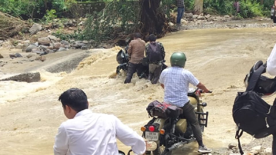 Bike rider saved from being washed away in swollen pond in almora