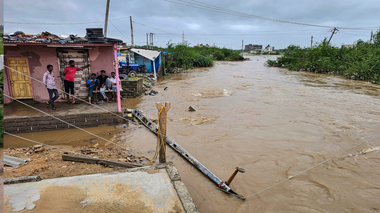 Couple spends two hours on roof of car swept away in river in Gujarat
