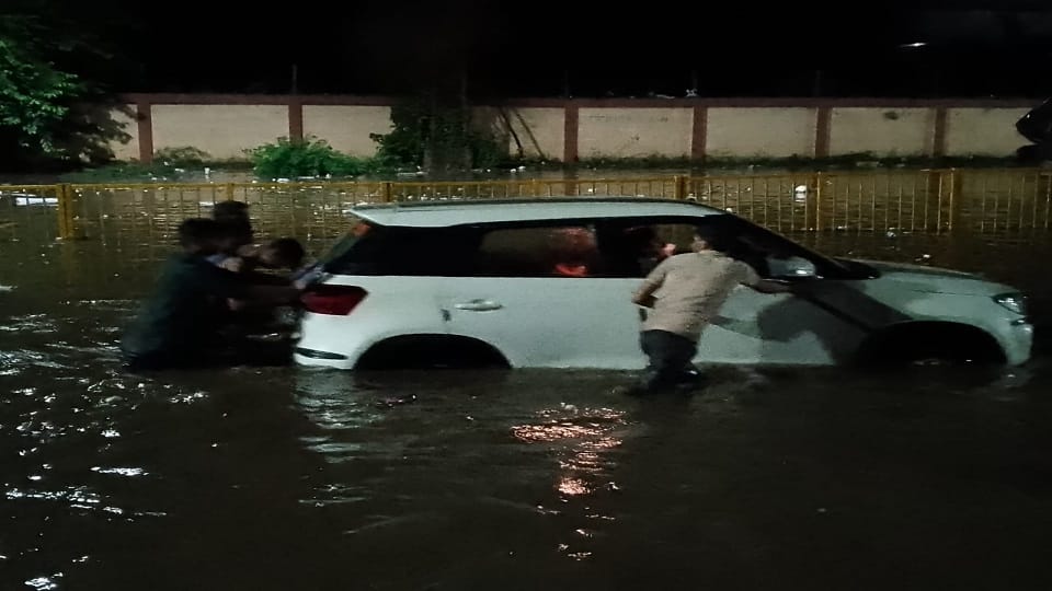 Chest-deep water on Delhi Highway Vehicles stuck creating long jam see photos