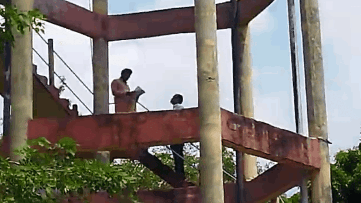 Frustrated by Tehsildar  order and youth climbed on water tank with petrol