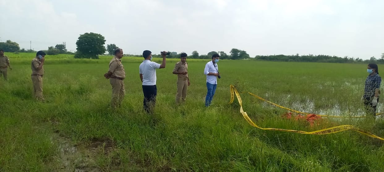 Half naked body of woman found lying in field, suspicion of murder after rape, police engaged in investigation