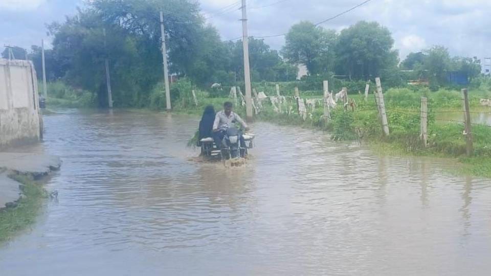 roads were flooded After the rain in Agra bikes were on roads and counters in shops were submerged