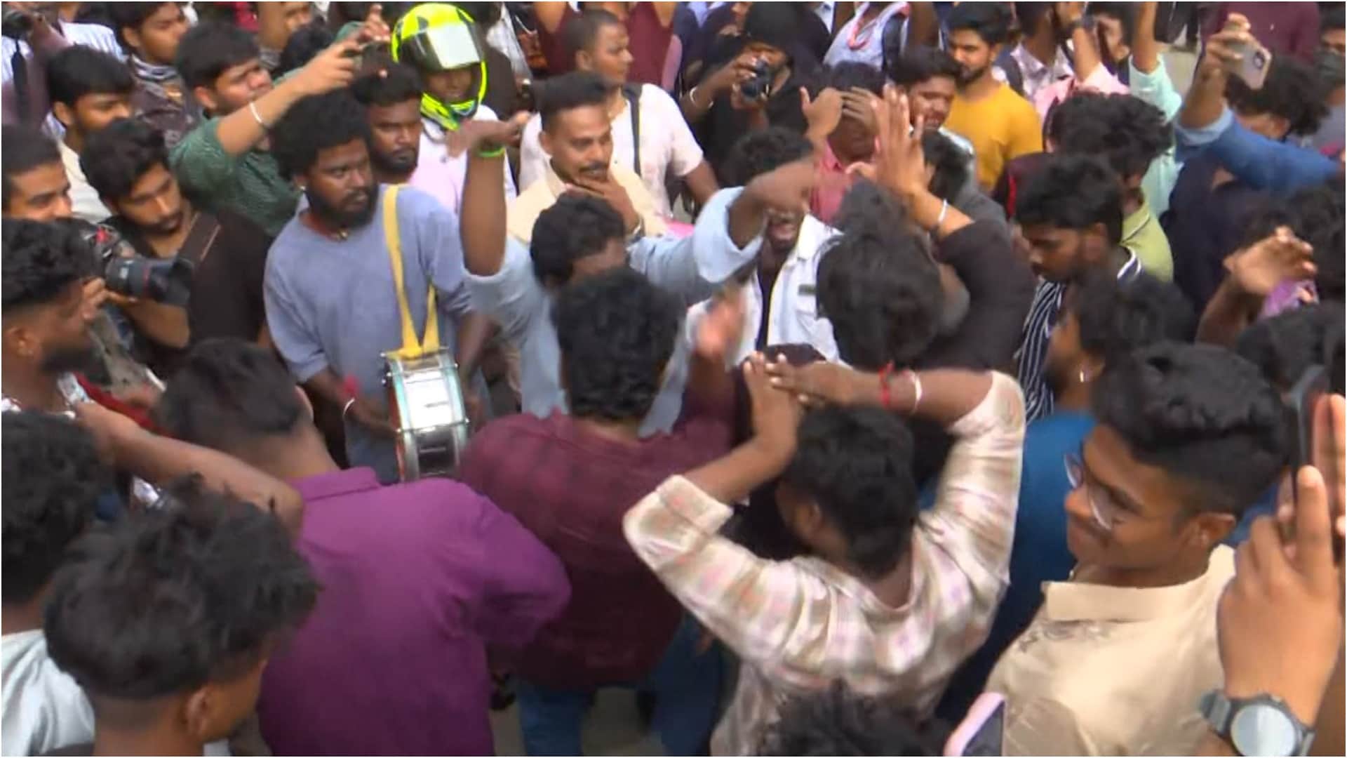 Thalapathy Vijay fans celebrate his movie the GOAT release dancing outside theaters pour milk on posters