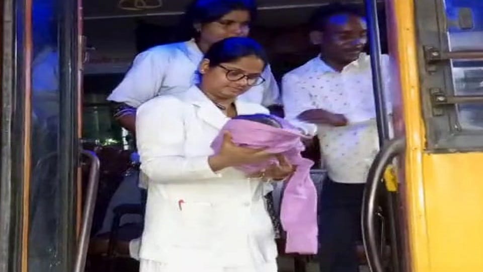Due to potholes in the road, woman delivers in roadways bus