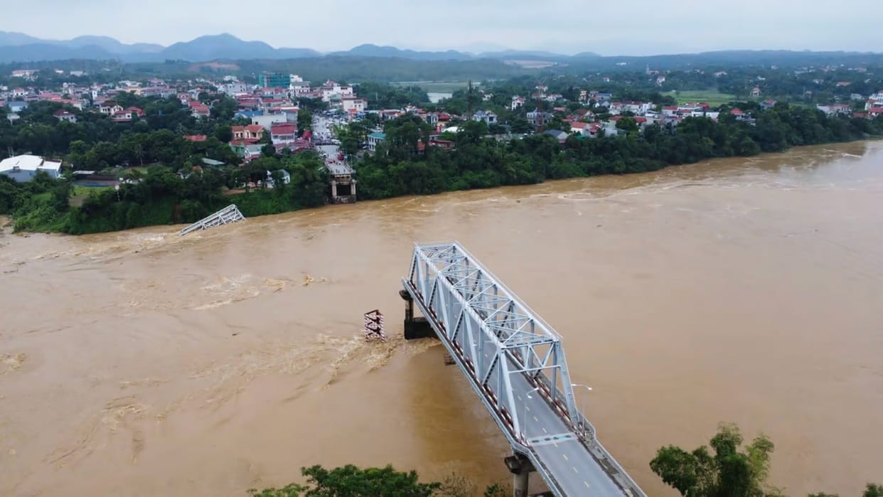 Flooding sweeps away a bus and a bridge collapses in Vietnam as storm deaths rise to 59 news updates