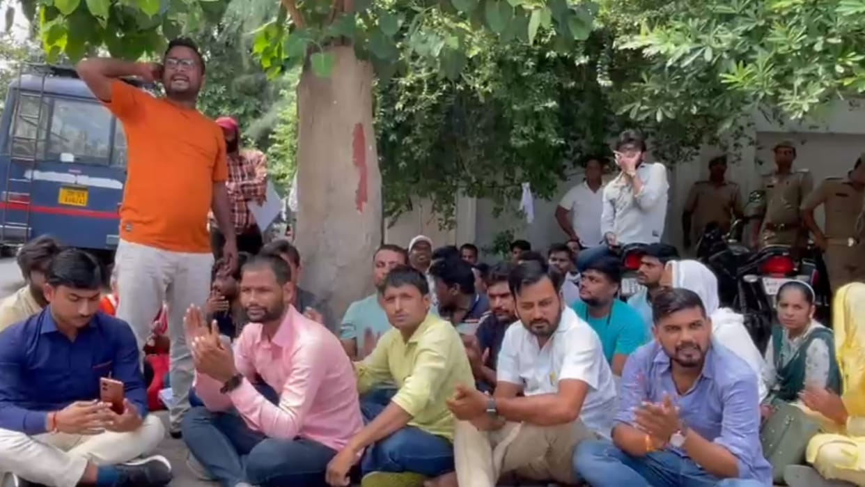 Applicants protest near Deputy CM Keshav Prasad Maurya home in Lucknow.