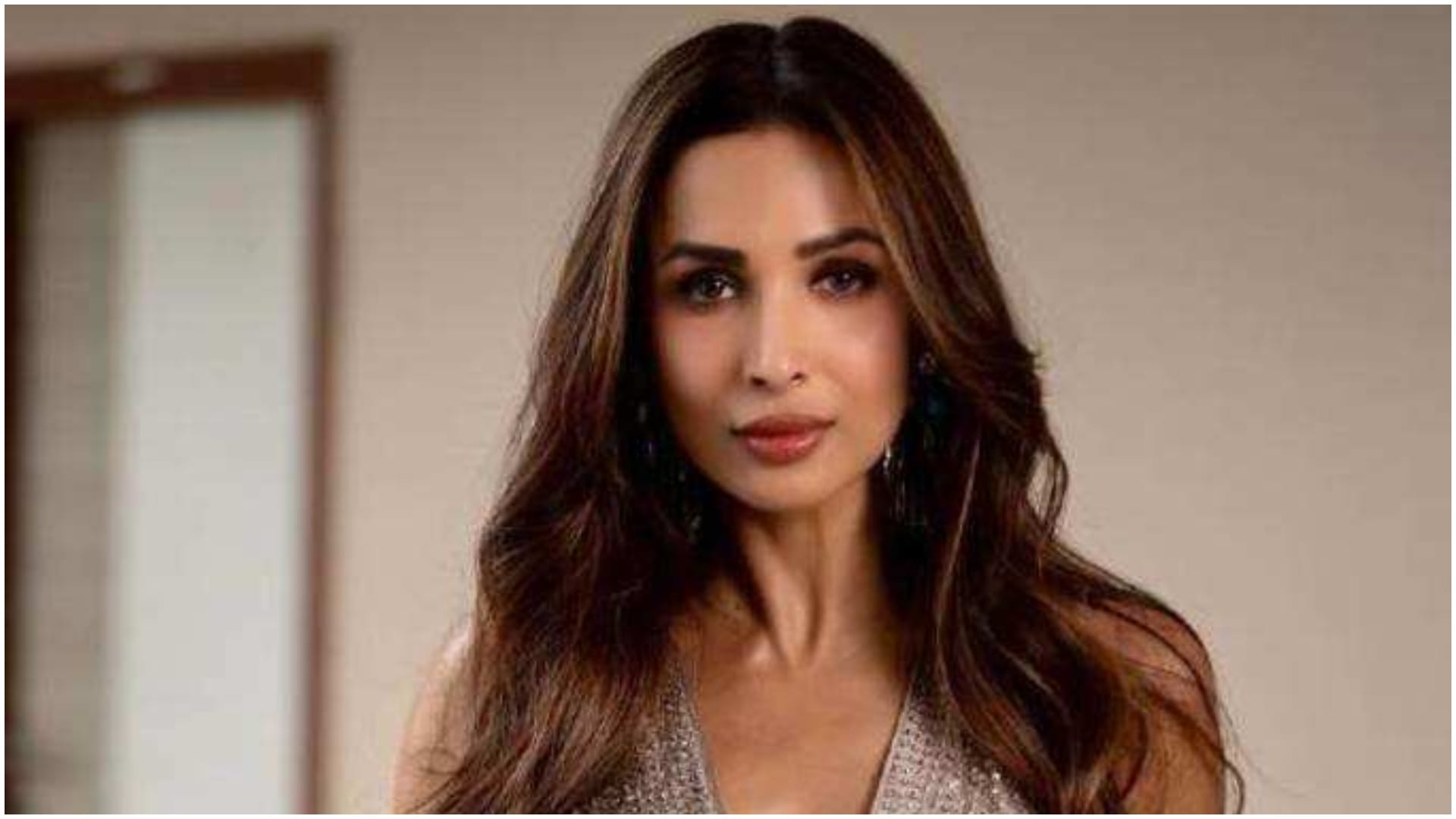 malaika arora walk the ramp in extremely bold deep neck gown