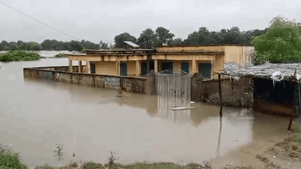 fields and houses submerged in water of Jamni river heavy rains in Lalitpur