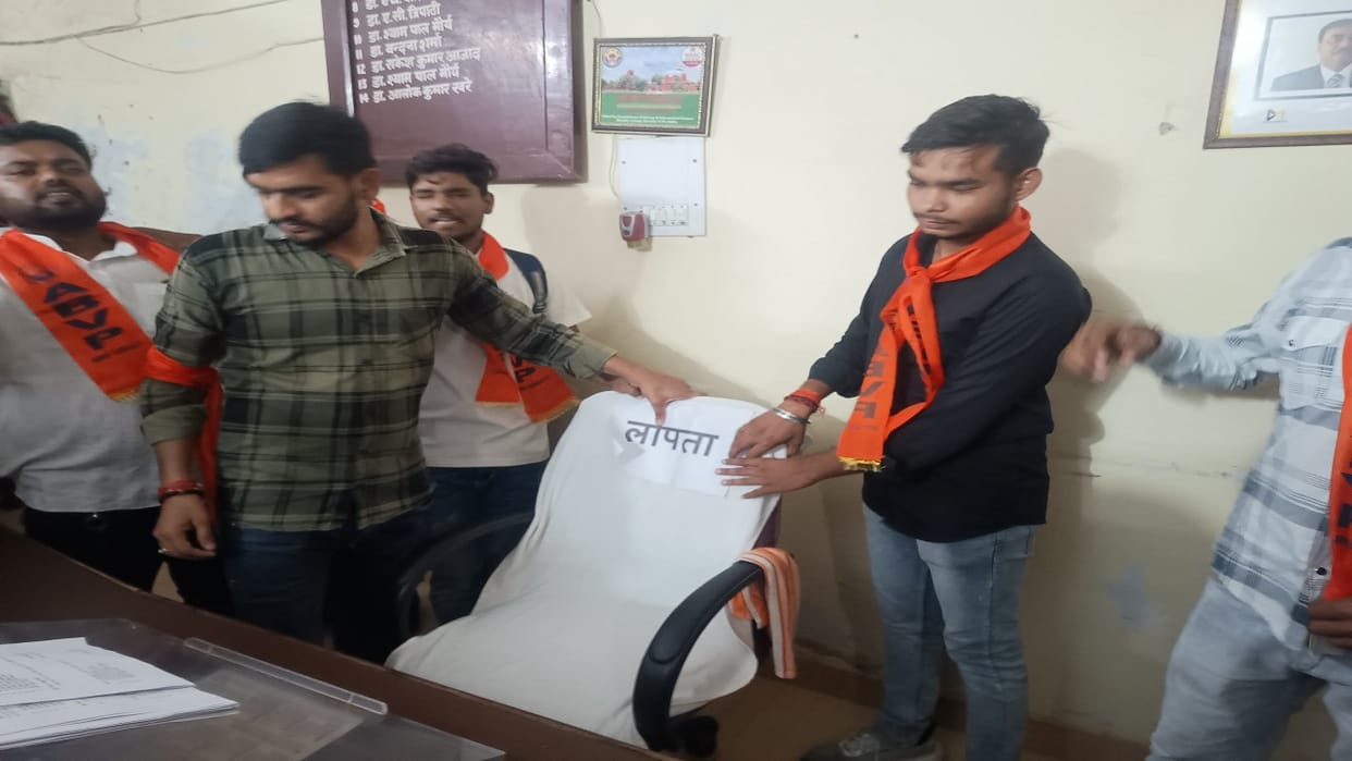 ABVP workers put a missing poster on the chair of the Chief Proctor in Bareilly College