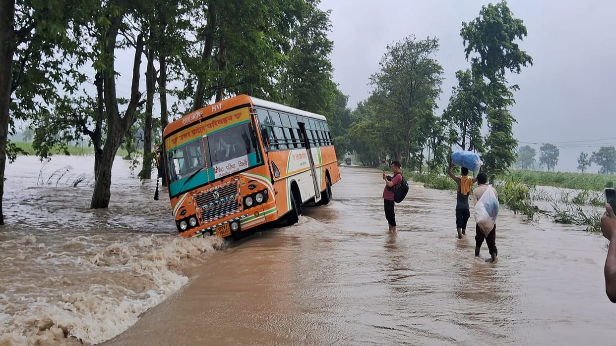 Roadways bus stuck on Palia-Bhira road amid strong water flow in lakhimpur kheri