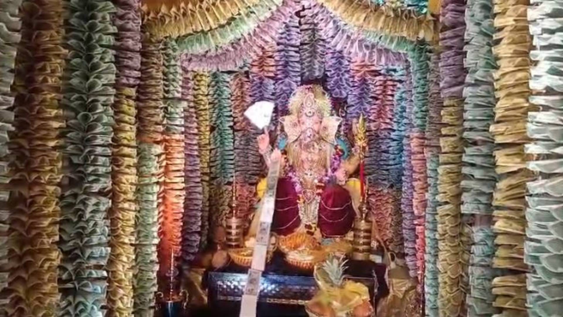 first time in Ujjain Ganesha pandal decorated with 11 lakh notes In pictures