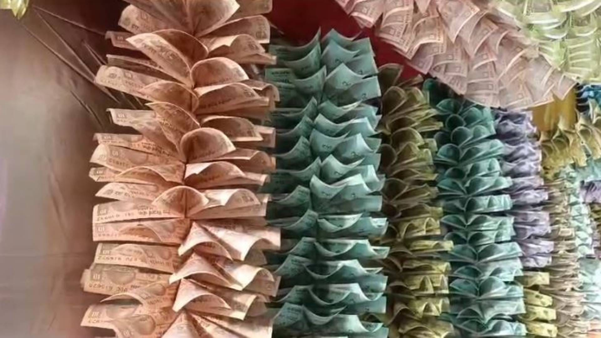 first time in Ujjain Ganesha pandal decorated with 11 lakh notes In pictures