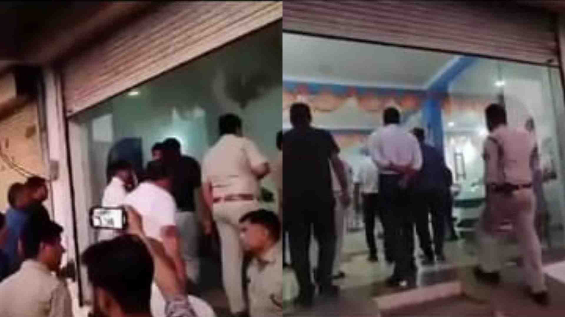 शोरूम में पुलिस के साथ पहुंचे विधायक।