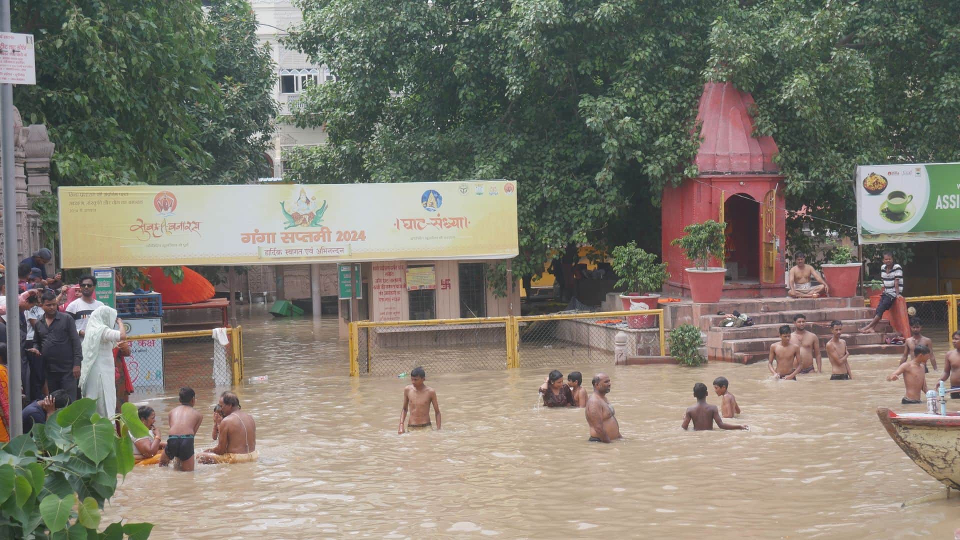 Flood in varanasi Boats in streets of Manikarnika Ganga flowing on road