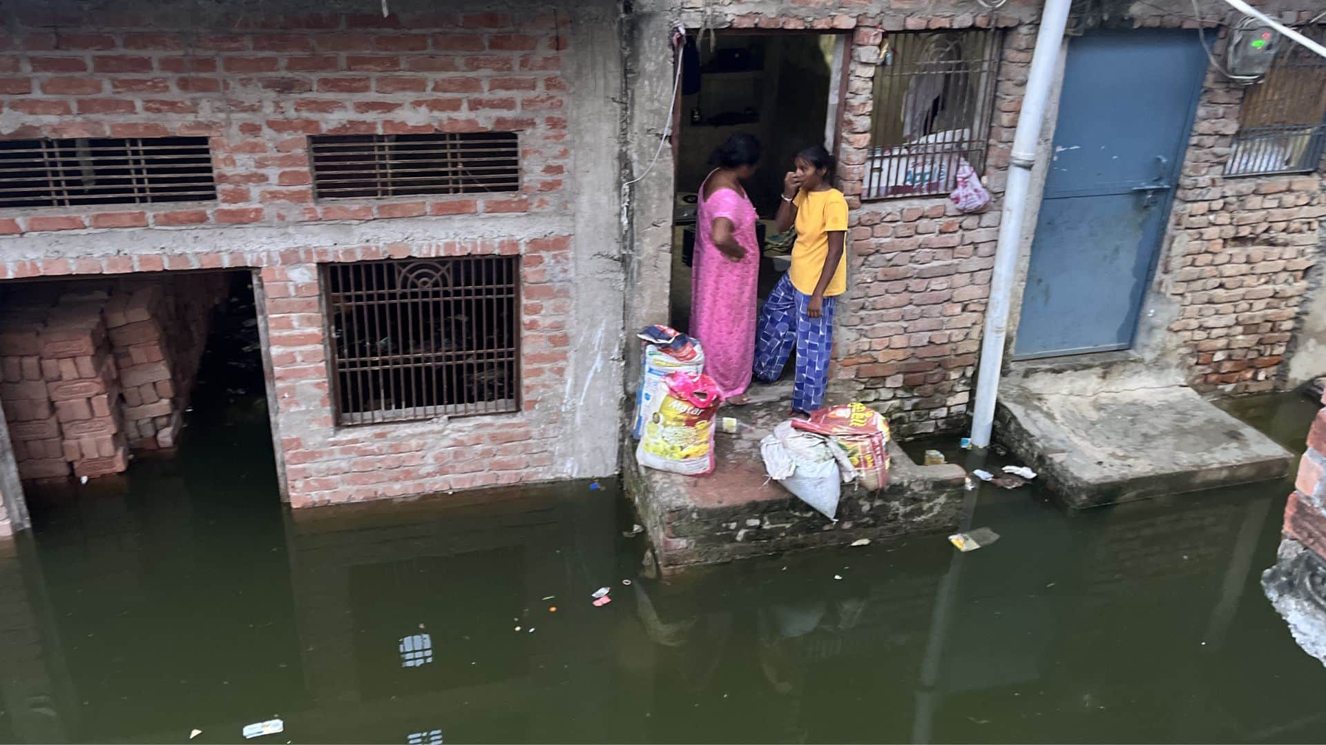 Flood in varanasi Boats in streets of Manikarnika Ganga flowing on road