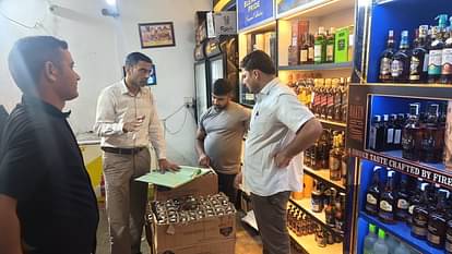 Dehradun DM Savin Bansal Raid on liquor shop as a customer shopkeeper gave bottle at over rating