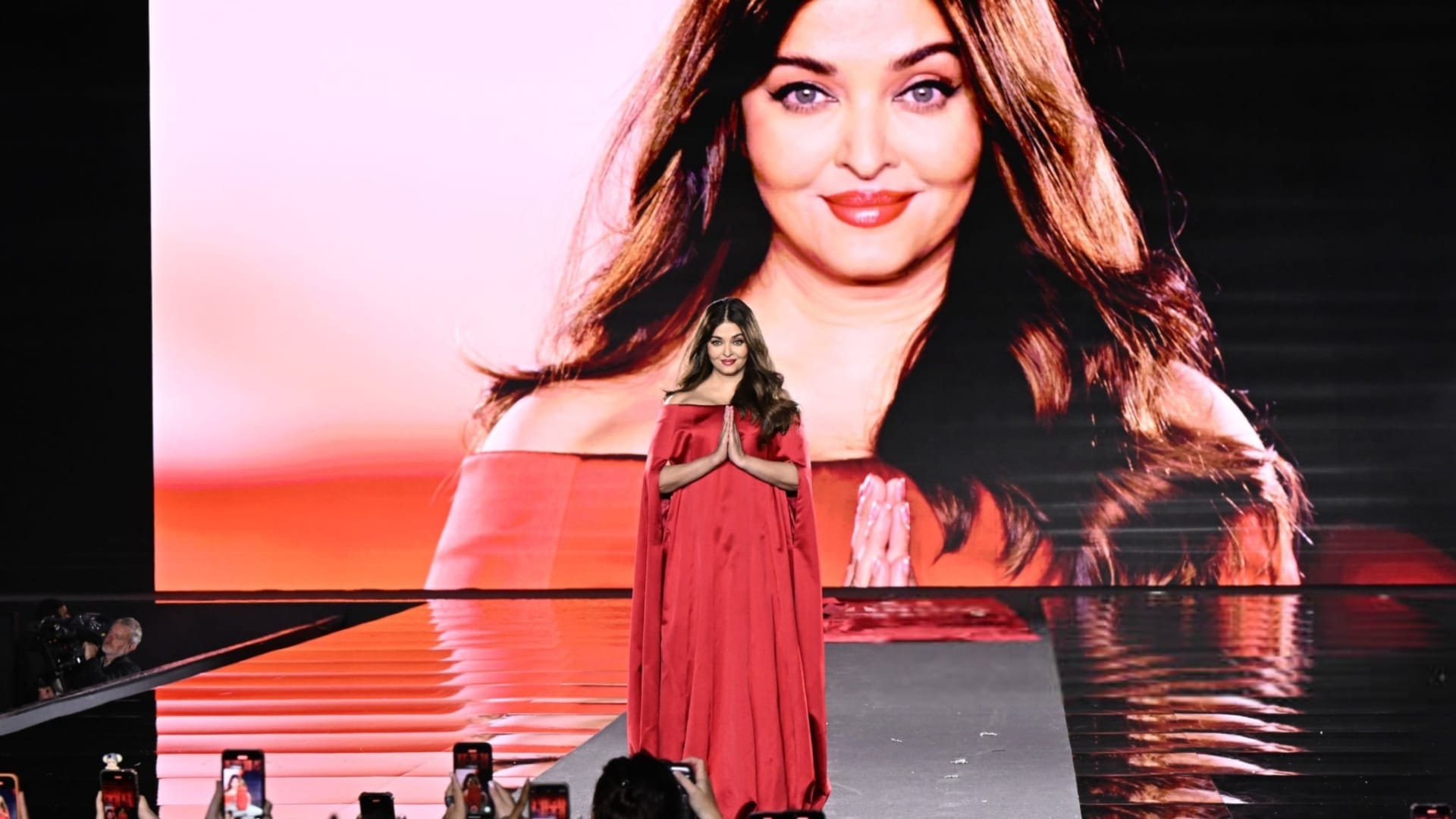 Aishwarya Rai Bachchan donned a red balloon hem dress with a dramatic train at Paris Fashion week
