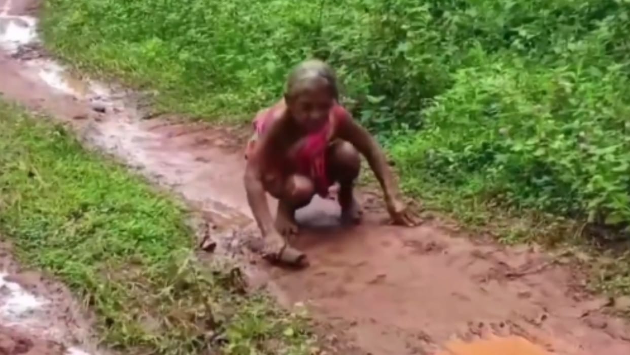 Woman crawling to panchayat office to received pension viral video news in hindi