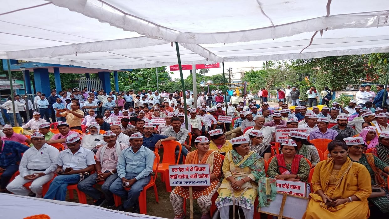 Employees took out protest march in Badaun for old pension scheme restoration