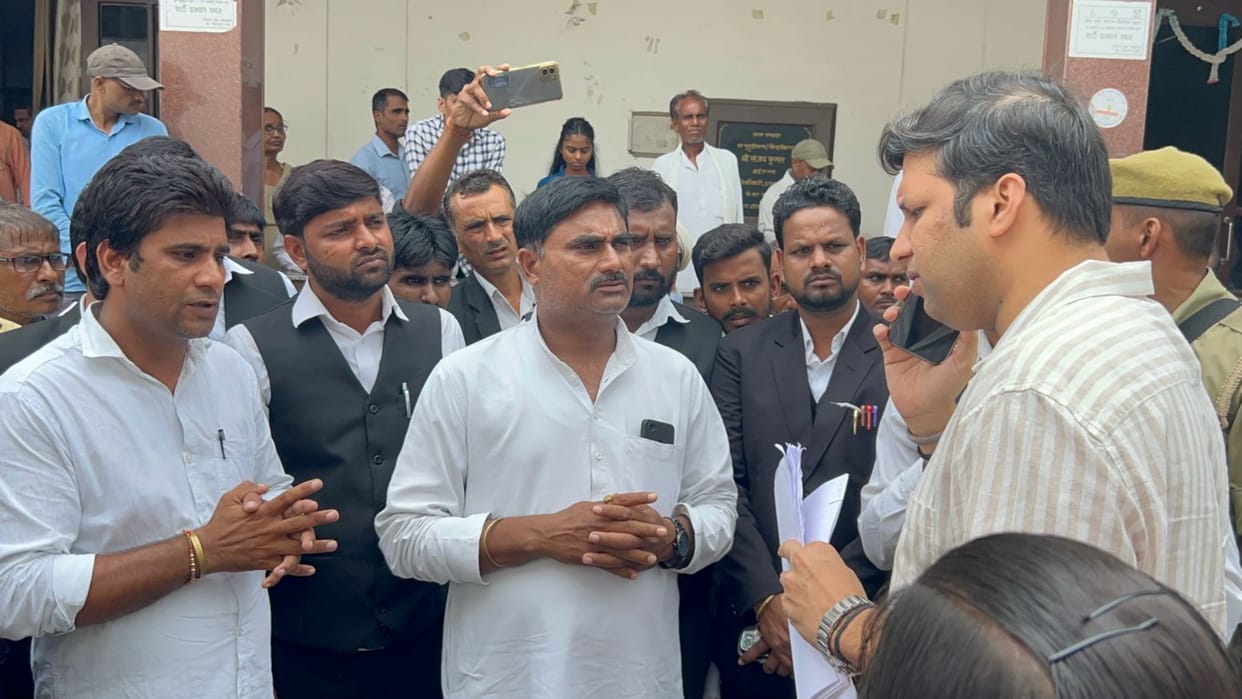 Villagers angry over occupation of government land, demonstrated at Collectorate along with Pradhan