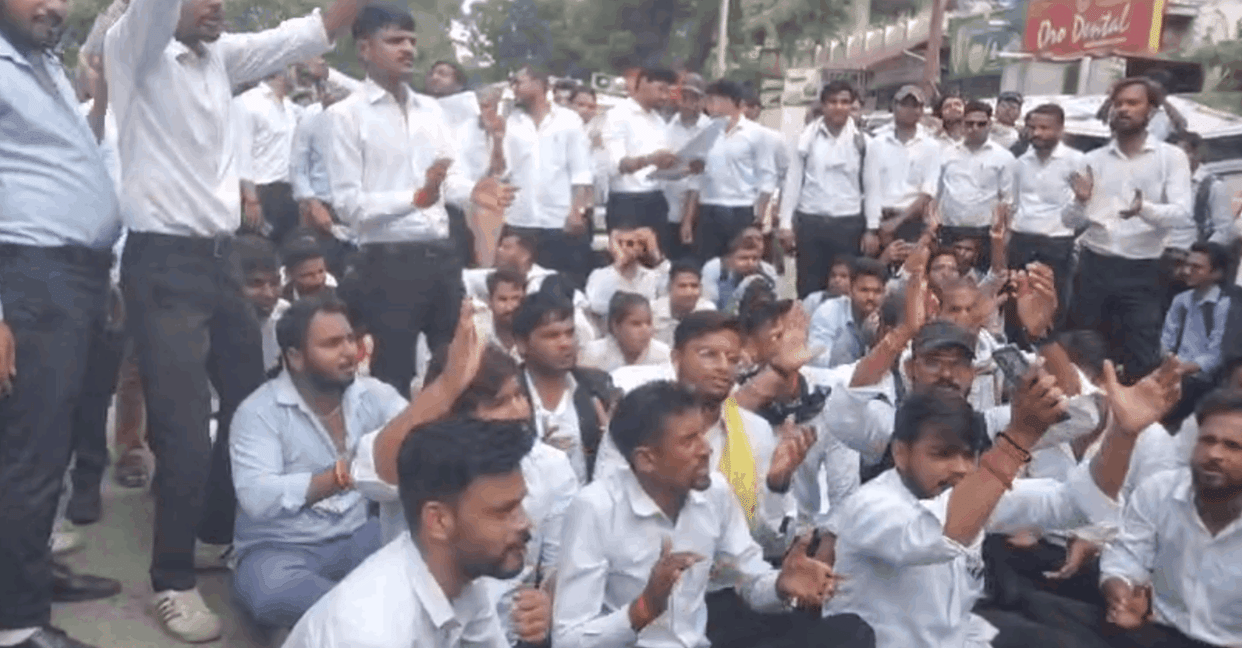 Students protesting against the written exam blocked the road in Aligarh