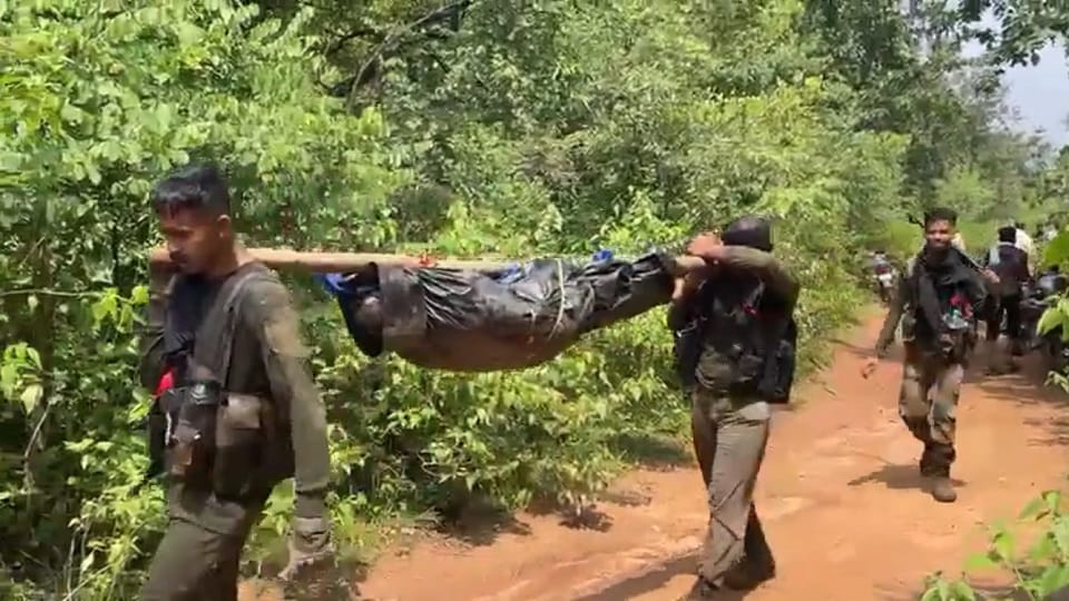 Chhattisgarh Naxal Encounter Soldiers returning from the jungle on foot carrying the bodies of Naxalites on th