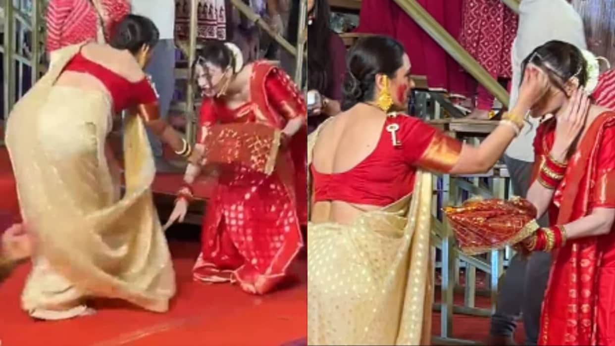 Rani Mukerji looked surprised as Sherlyn Chopra approached her and touched her feet during sindoor khela
