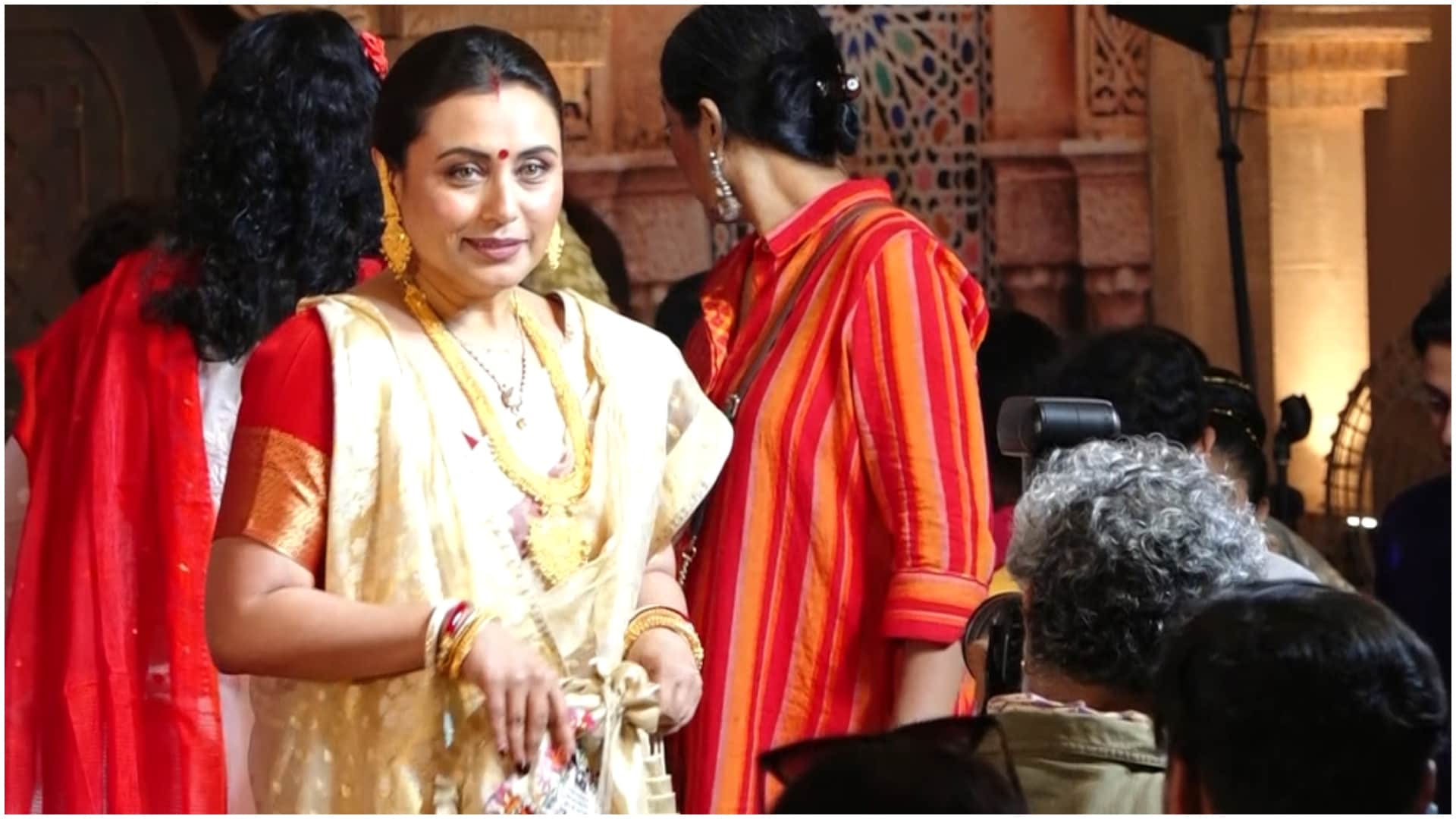 Rani Mukerji looked surprised as Sherlyn Chopra approached her and touched her feet during sindoor khela