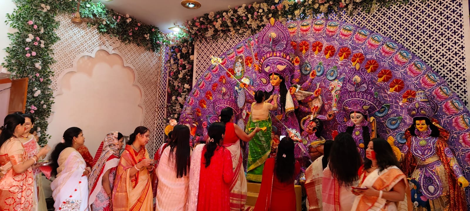 Women play sindoor on the day of Durga idols immersion in Lucknow.