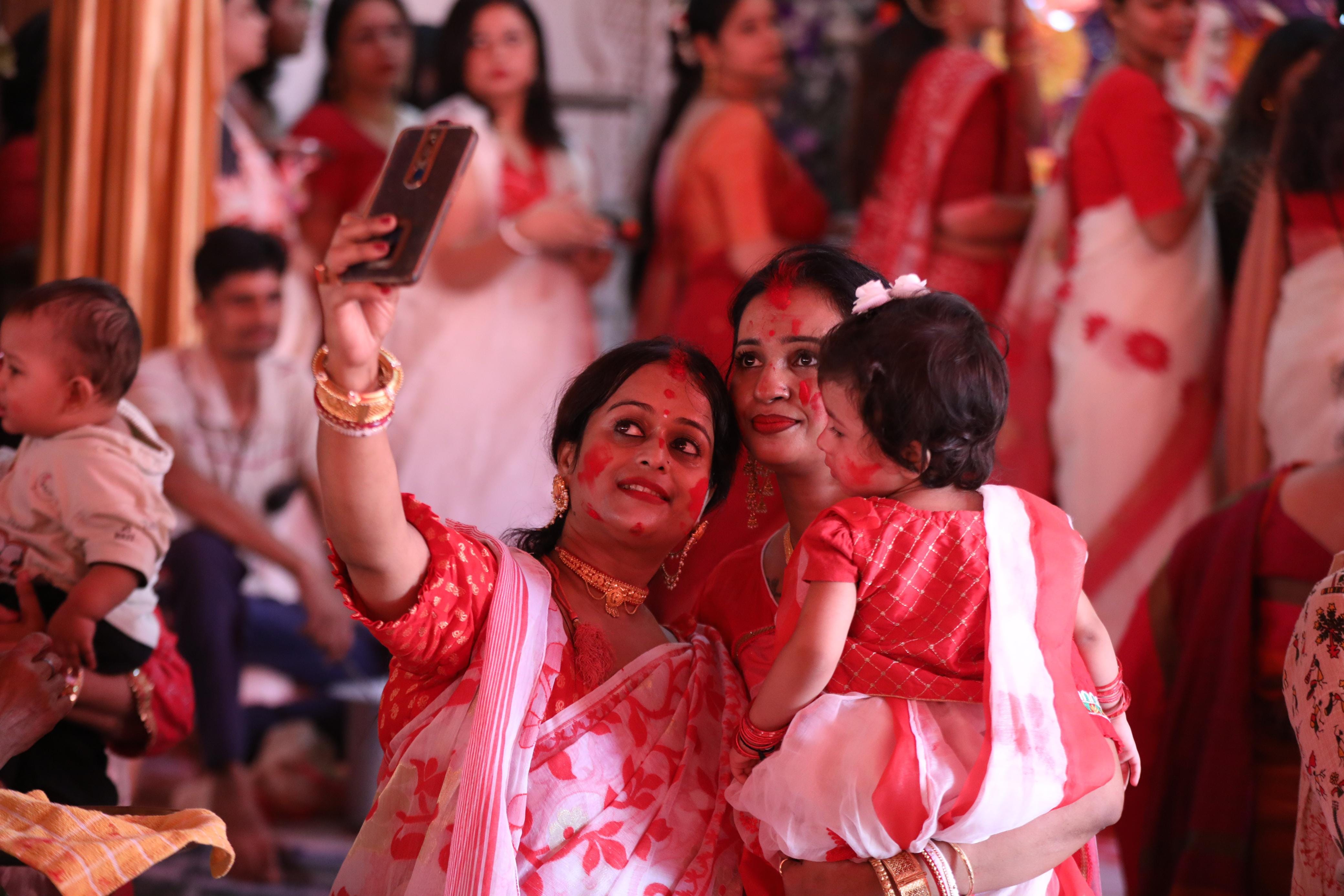 Women play sindoor on the day of Durga idols immersion in Lucknow.