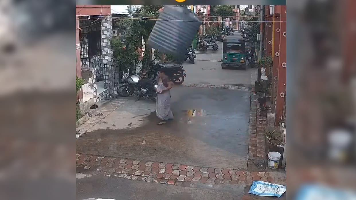 Viral Video woman crossing the lane suddenly gets hit by a falling water tank