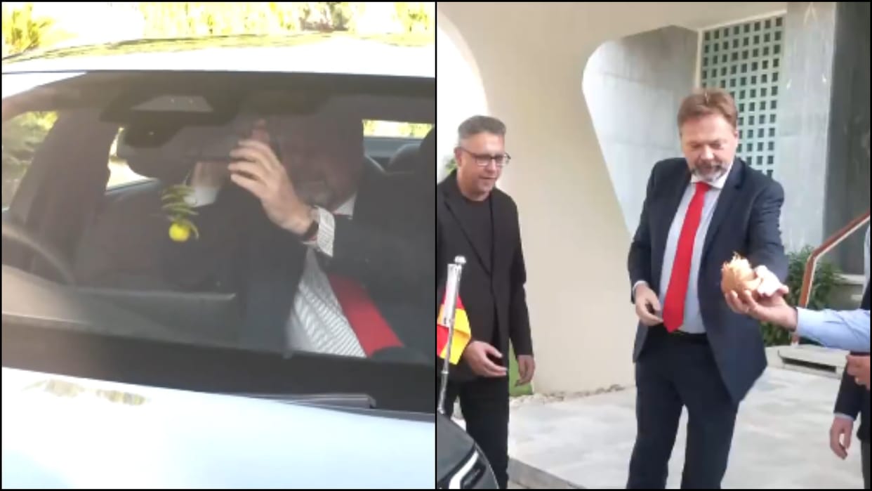 German envoy smashes coconut, ties nimbu mirchi to his new Electric vehicle news in hindi
