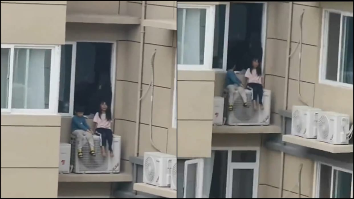 Chinese Woman Risks Children Lives On AC Unit To Upset Husband During Argument news in hindi