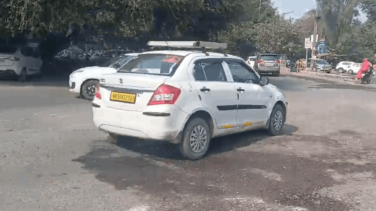 Vehicles are welcomed by potholes at the city roundabouts in Faridabad