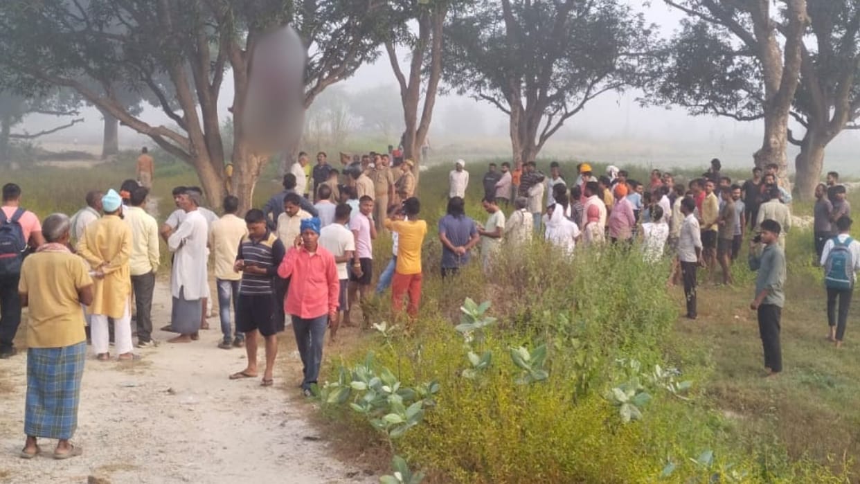 dead body of young hanging from tree in bhadohi crashed pickup parked at distance relatives suspected murder