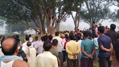 dead body of young hanging from tree in bhadohi crashed pickup parked at distance relatives suspected murder