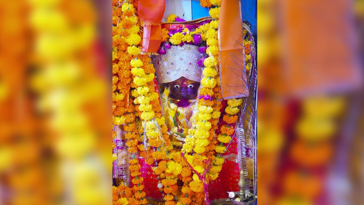 The god of wealth Kubera sits with Shiva and his family in this 1200-year-old temple