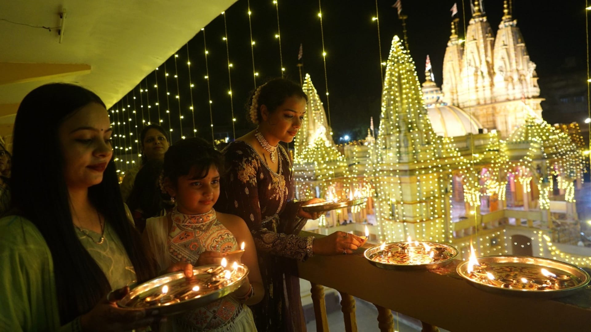 diwali 2024 celebrations lighting diyas sweets festive moments people joy photos