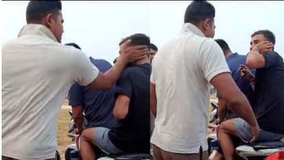 युवक को तमाचा मारता पुलिस कर्मी