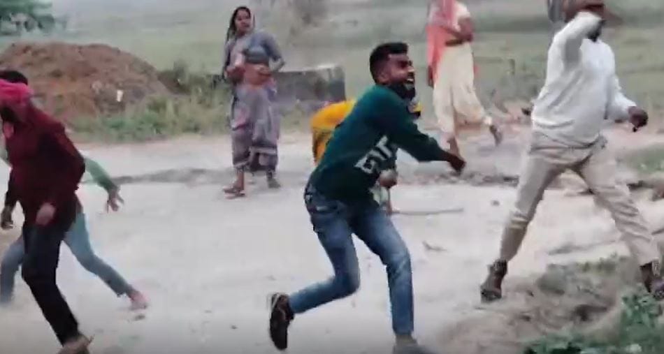 Video of people throwing stones with guns goes viral