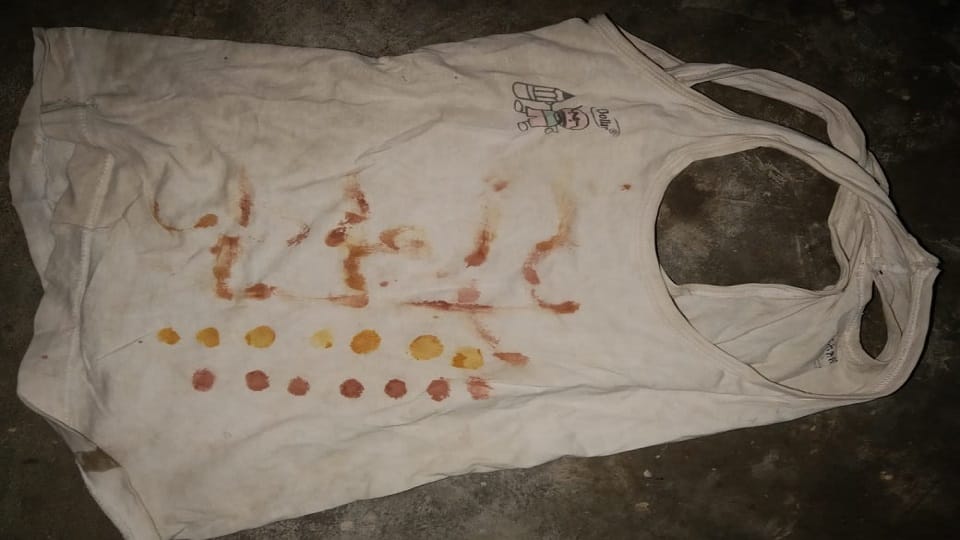 Murderous mother: Son's name written on vest with blood 21 dots then brutally slit his throat