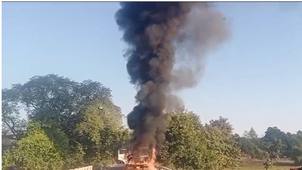 Trailer was going on the road suddenly it started burning driver saved his life by jumping queue of vehicle