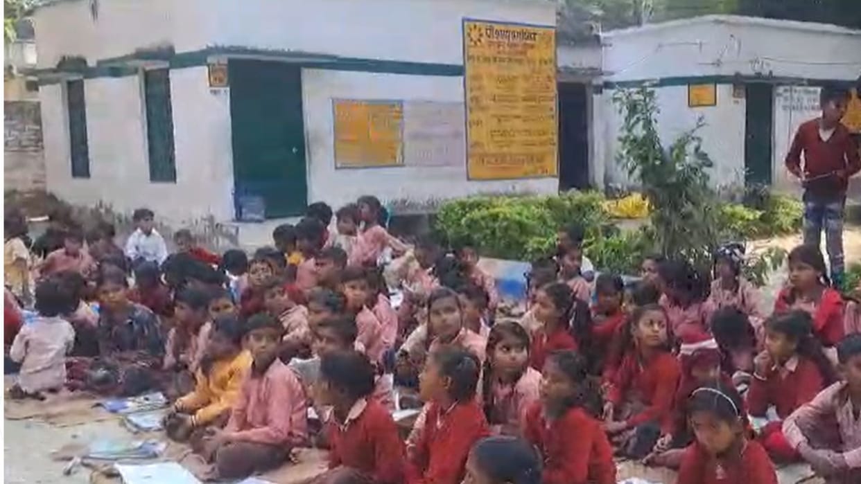 Distribution of bags and socks in primary schools students faces lit up