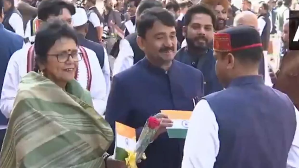 Small tricolour, red rose in hand, Opposition MPs urge government to run House