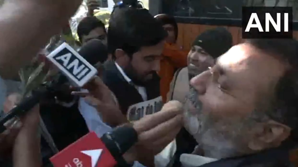 nsui workers unique protest outside bjp mp nishikant dubey in delhi offerd him sweets flowers