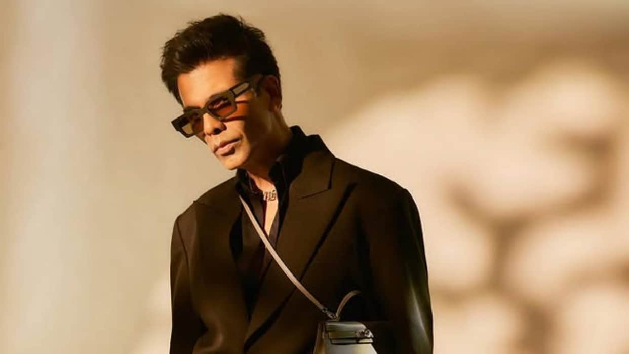 Karan Johar Look in Black Formals with Ladies purse goes viral he says fashion ka koi Gender Nahi hota