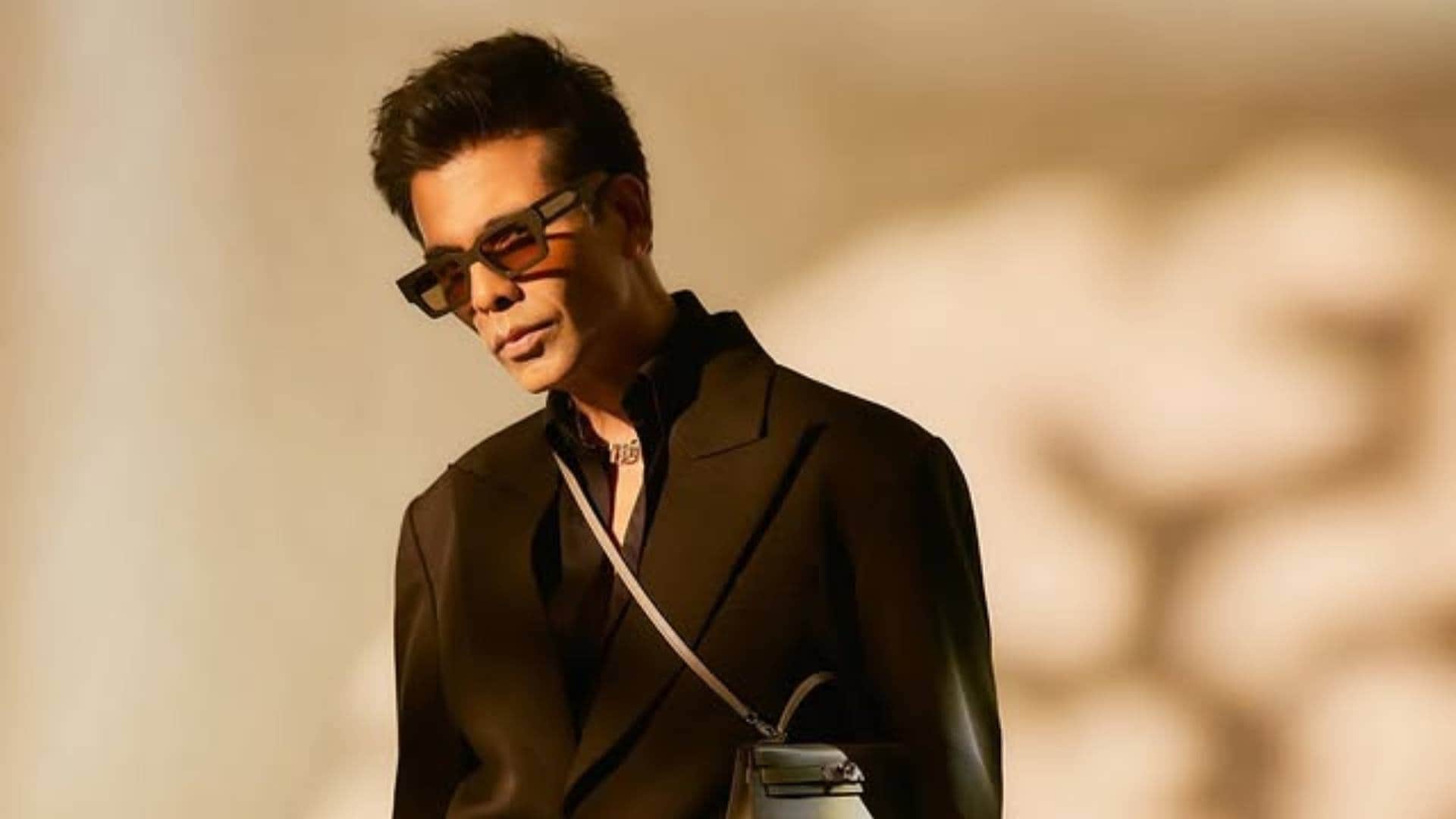 Karan Johar Look in Black Formals with Ladies purse goes viral he says fashion ka koi Gender Nahi hota