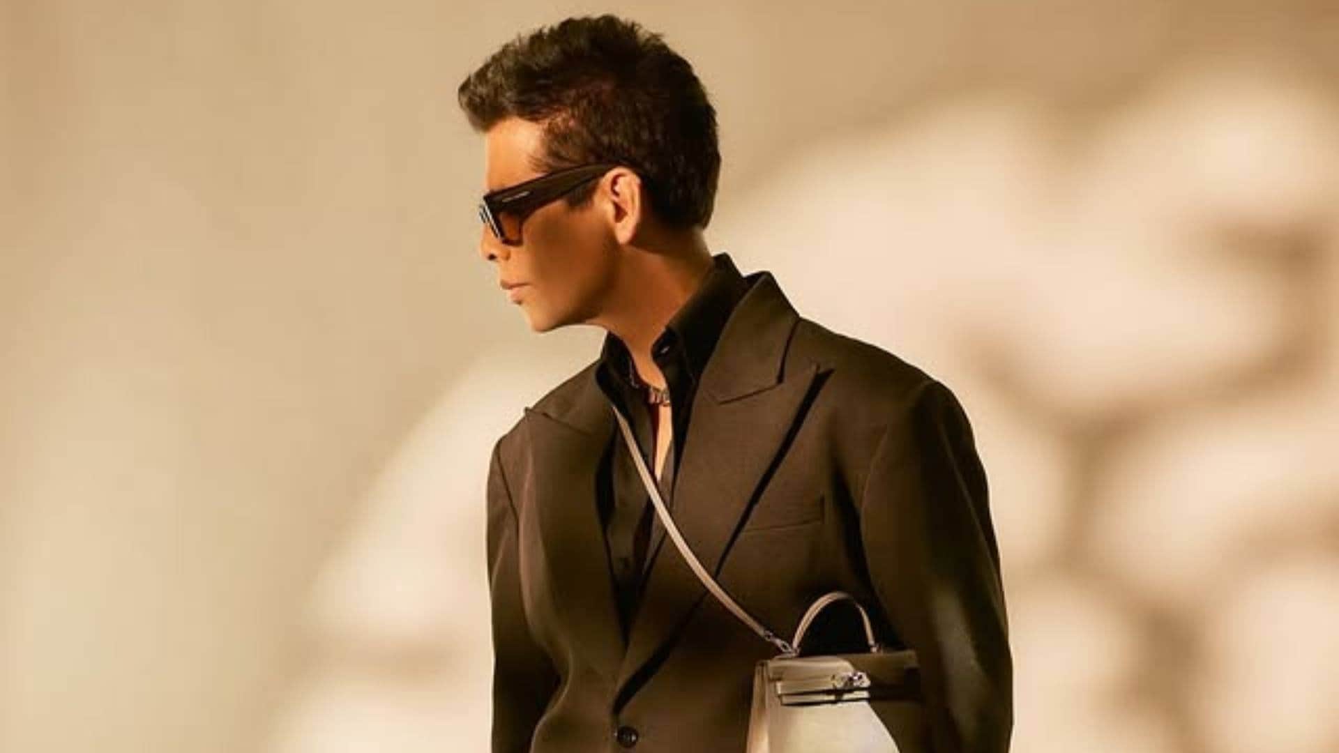 Karan Johar Look in Black Formals with Ladies purse goes viral he says fashion ka koi Gender Nahi hota